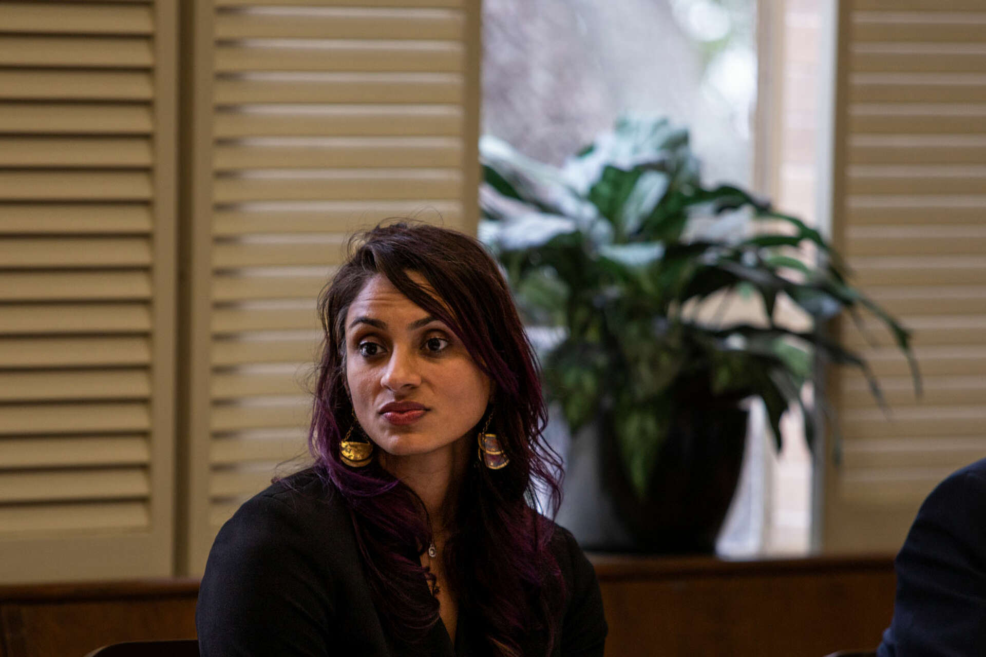 San Antonio District 1 Councilmember Sukh Kaur seated at a public meeting